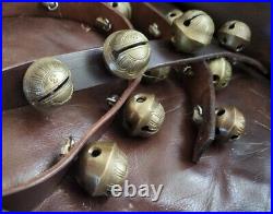 26 vintage antique 1 1/2 inch sleigh bells, Bronze number 3 bells on brown strap