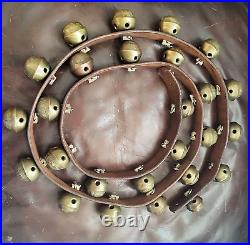 26 vintage antique 1 1/2 inch sleigh bells, Bronze number 3 bells on brown strap
