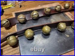 26 vintage antique 1 1/2 inch sleigh bells, Bronze number 3 bells on brown strap
