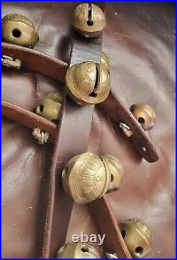 26 vintage antique 1 1/2 inch sleigh bells, Bronze number 3 bells on brown strap