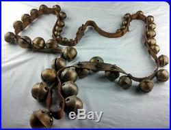 40 antique brass sleigh bells with leather strap
