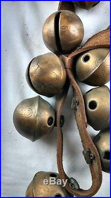 40 antique brass sleigh bells with leather strap
