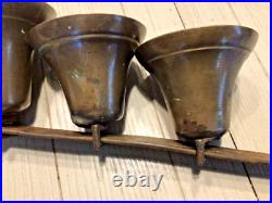 4 Antique brass Sleigh Bells on a 16 iron bar. Horse / Carriage