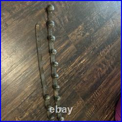 67 ANTIQUE BRASS SLEIGH BELLS ON LEATHER STRAP heavy