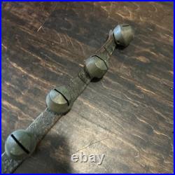 67 ANTIQUE BRASS SLEIGH BELLS ON LEATHER STRAP heavy