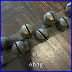 67 ANTIQUE BRASS SLEIGH BELLS ON LEATHER STRAP heavy