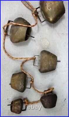 Antique 6 HANGING BRASS COWBELLS graduated vintage metal knocker rust color