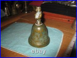 Antique Engraved Brass Bronze Bell With Figure in Cloak Holding Treasure