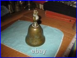 Antique Engraved Brass Bronze Bell With Figure in Cloak Holding Treasure