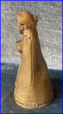 Antique Engraved Brass Bronze Bell With Figure in Cloak Holding Treasure. 5x2.5