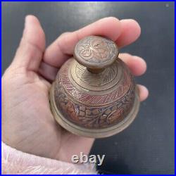 Antique brass elephant claw bell