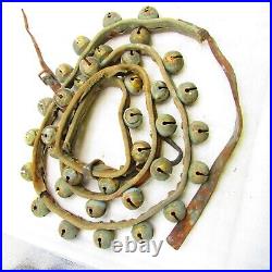 Antique brass sleigh bells, 36 on leather strap