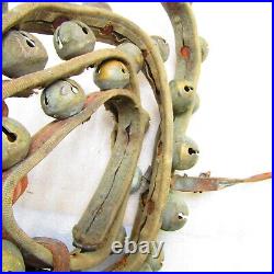 Antique brass sleigh bells, 36 on leather strap