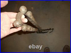 Antique brass sleigh bells 42 on single old leather horse strap with buckle