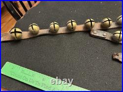 String of 34 1 Antique 1878 Brass Sleigh Bells Great Bells, Strap Not So Much