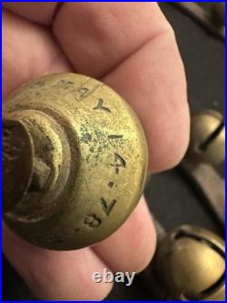 String of 34 1 Antique 1878 Brass Sleigh Bells Great Bells, Strap Not So Much