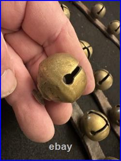 String of 34 1 Antique 1878 Brass Sleigh Bells Great Bells, Strap Not So Much