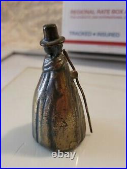 Vintage/antique bronze hand bell figural woman in cape with cane 4 tall